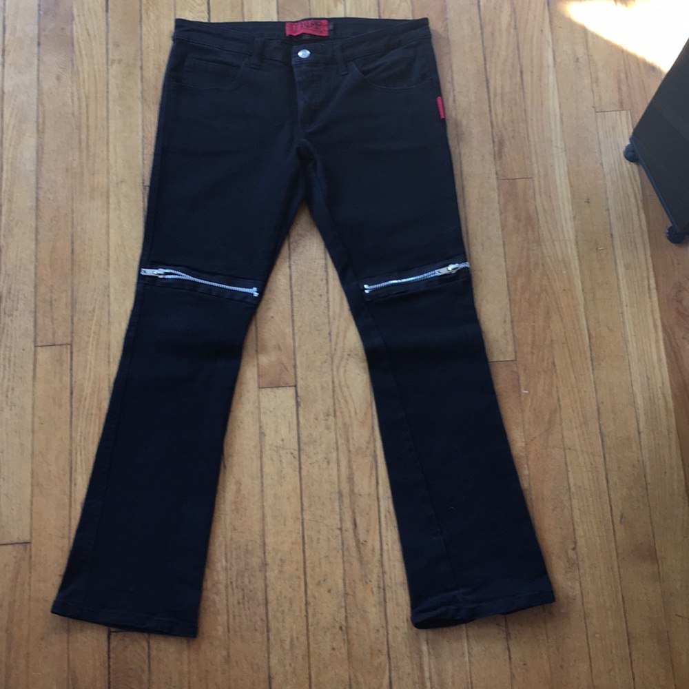 Flare jeans with zipper detail on thighs